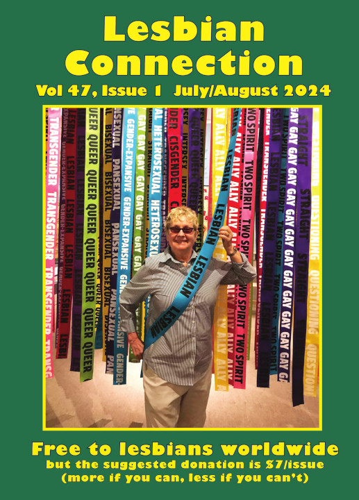 LC cover image for Volume 47 Issue 1, depicts subscriber, Diane Germain, taken in 2018 at the first LGBTQ exhibit at the San Diego History Center. Photo taken by Angela Brinskele. Diane is grinning while proudly draping a sash with the word "LESBIAN" written on it several times. She chose that sash from several others with other LGBTQ labels hanging from a display.
